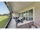 Relaxing screened porch, offering an outdoor sitting area at 5608 Madrigal Way, Apollo Beach, FL 33572