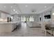 Open concept kitchen with island and stainless steel appliances at 5608 Madrigal Way, Apollo Beach, FL 33572