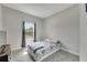 Cozy bedroom with a queen-size bed and a window overlooking the backyard at 5608 Madrigal Way, Apollo Beach, FL 33572