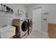 Laundry room with washer, dryer, and utility sink at 5608 Madrigal Way, Apollo Beach, FL 33572