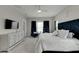 Main bedroom with large bed, dresser, and seating area at 5608 Madrigal Way, Apollo Beach, FL 33572