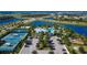 Aerial view of community amenities including pools, tennis courts and parking at 5608 Madrigal Way, Apollo Beach, FL 33572