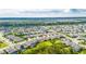 Aerial view of a house nestled in a well-established neighborhood at 5608 Madrigal Way, Apollo Beach, FL 33572