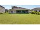 Large backyard with screened patio at 5608 Madrigal Way, Apollo Beach, FL 33572