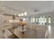 Open concept dining area with kitchen and living room views at 5608 Madrigal Way, Apollo Beach, FL 33572