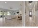 Open living and dining area with light wood floors and neutral furniture at 5608 Madrigal Way, Apollo Beach, FL 33572
