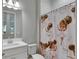 Clean bathroom with a shower/tub combo and a vanity with a white countertop at 5608 Madrigal Way, Apollo Beach, FL 33572