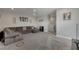 Spacious bonus room with large sectional sofa, TV, and carpeted floor at 5608 Madrigal Way, Apollo Beach, FL 33572