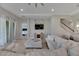 Open living space with sectional sofa, hardwood floors, and access to other rooms at 5608 Madrigal Way, Apollo Beach, FL 33572