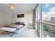 King-size bed, large windows and city views at 450 Knights Run Ave # 702, Tampa, FL 33602