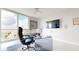 Spacious home office with large window offering city views at 450 Knights Run Ave # 702, Tampa, FL 33602