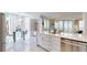 Modern kitchen with island, stainless steel appliances, and white cabinetry at 450 Knights Run Ave # 702, Tampa, FL 33602
