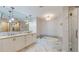 Spa-like bathroom with double vanity, soaking tub and shower at 450 Knights Run Ave # 702, Tampa, FL 33602
