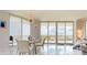 Bright dining area with glass table and city views at 450 Knights Run Ave # 702, Tampa, FL 33602