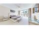 Bright bedroom with a king-size bed, large windows and city view at 450 Knights Run Ave # 702, Tampa, FL 33602