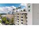 Balcony view of the cityscape and a modern parking garage with artistic design at 450 Knights Run Ave # 702, Tampa, FL 33602