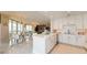 Modern white kitchen with stainless steel appliances and breakfast bar at 450 Knights Run Ave # 702, Tampa, FL 33602