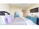Bright bedroom with a bed and teal storage at 450 Knights Run Ave # 702, Tampa, FL 33602