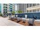 Community patio with seating areas near a water feature at 450 Knights Run Ave # 702, Tampa, FL 33602