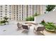 Relaxing courtyard with fire pit and seating at 450 Knights Run Ave # 702, Tampa, FL 33602