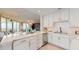 Contemporary kitchen with white cabinets, quartz counters, and stainless steel appliances at 450 Knights Run Ave # 702, Tampa, FL 33602