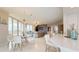 Open living room with a gray sofa and access to balcony at 450 Knights Run Ave # 702, Tampa, FL 33602