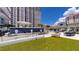 Community patio with seating areas, water features, and artificial turf at 450 Knights Run Ave # 702, Tampa, FL 33602