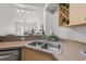 Modern kitchen with double sink and stainless steel dishwasher at 200 4Th S Ave # 322, St Petersburg, FL 33701