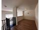 Spacious loft bedroom with wood-look floors and window at 501 Knights Run Ave # 1327, Tampa, FL 33602