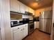 White cabinets, granite countertops, stainless steel appliances at 501 Knights Run Ave # 1327, Tampa, FL 33602