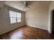 Spacious bedroom with ceiling fan and wood-look floors at 501 Knights Run Ave # 1327, Tampa, FL 33602