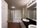 Bathroom with double vanity, soaking tub and glass shower at 501 Knights Run Ave # 1327, Tampa, FL 33602