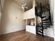 Living room with spiral staircase and high ceilings at 501 Knights Run Ave # 1327, Tampa, FL 33602