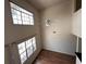 Spacious living room with two large windows and a ceiling fan at 501 Knights Run Ave # 1327, Tampa, FL 33602