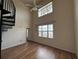 Bright living room featuring large windows, high ceilings and wood-look floors at 501 Knights Run Ave # 1327, Tampa, FL 33602