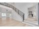 Bright and airy living room with hardwood floors and a view of the staircase at 6012 Kipps Colony E Dr, Gulfport, FL 33707