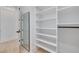 Large walk-in closet with ample shelving and hanging space at 6012 Kipps Colony E Dr, Gulfport, FL 33707