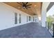 Covered balcony with wood ceilings, tile flooring and view at 6012 Kipps Colony E Dr, Gulfport, FL 33707