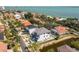 Aerial view of a waterfront home with a private pool and lush landscaping at 6012 Kipps Colony E Dr, Gulfport, FL 33707