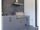 Stainless steel grill and outdoor kitchen with stone facade at 6012 Kipps Colony E Dr, Gulfport, FL 33707