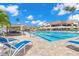 Community pool with lounge chairs and a relaxing atmosphere at 6012 Kipps Colony E Dr, Gulfport, FL 33707