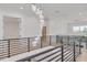 Open upper hallway with modern light fixture and elevator access at 6012 Kipps Colony E Dr, Gulfport, FL 33707