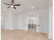 Spacious bedroom with hardwood floors, ceiling fan, and access to upper level at 6012 Kipps Colony E Dr, Gulfport, FL 33707