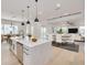Open concept kitchen and living area with large island and modern finishes at 6012 Kipps Colony E Dr, Gulfport, FL 33707