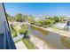 Property with pond and surrounding houses visible at 6012 Kipps Colony E Dr, Gulfport, FL 33707