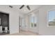 Spacious bedroom with light wood floors and large windows at 6012 Kipps Colony E Dr, Gulfport, FL 33707