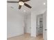 Bedroom with ceiling fan, hardwood floors, and walk-in closet at 6012 Kipps Colony E Dr, Gulfport, FL 33707