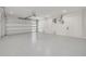 Spacious garage with epoxy flooring and automatic door at 6012 Kipps Colony E Dr, Gulfport, FL 33707