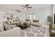 Open floor plan living room with neutral tones and plenty of natural light at 6012 Kipps Colony E Dr, Gulfport, FL 33707