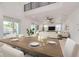 Open concept dining area with a large wooden table and seating for six at 6012 Kipps Colony E Dr, Gulfport, FL 33707
